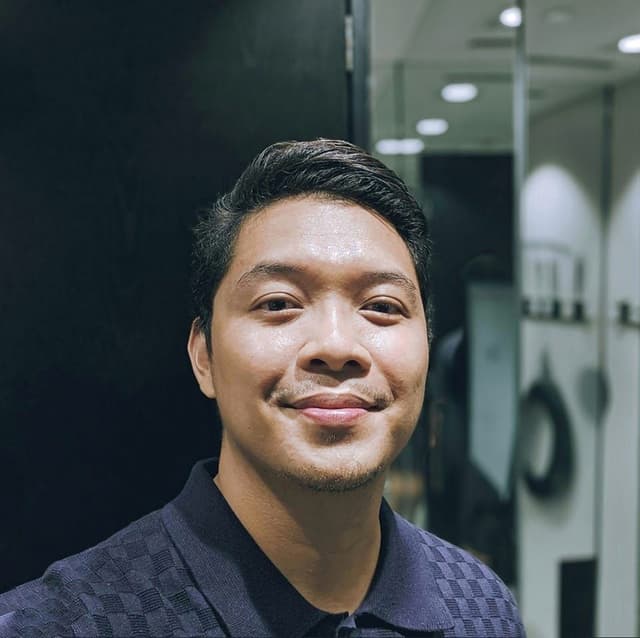A professional headshot of Chris Diomampo, Full Stack Developer.